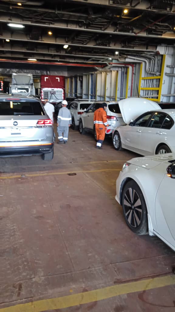 Crew and cars on the enclosed vehicle deck